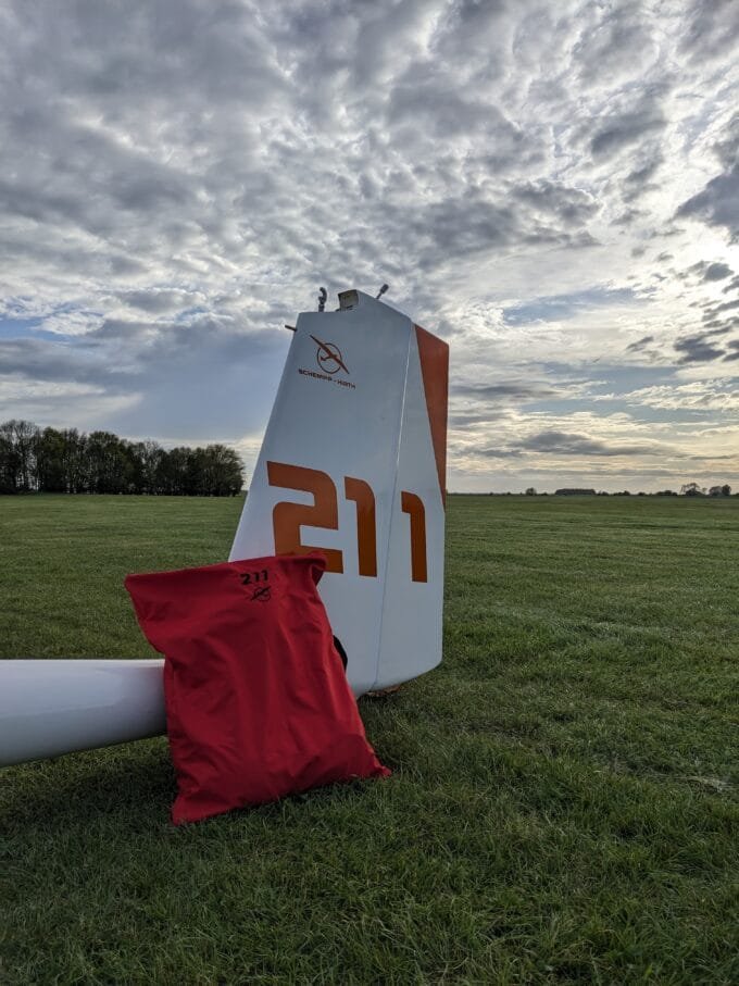 Red Parachute Bag (against a Glider)